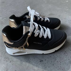 Girl’s Skechers Black Sneakers with Metallic Gold Accents and charms size 2